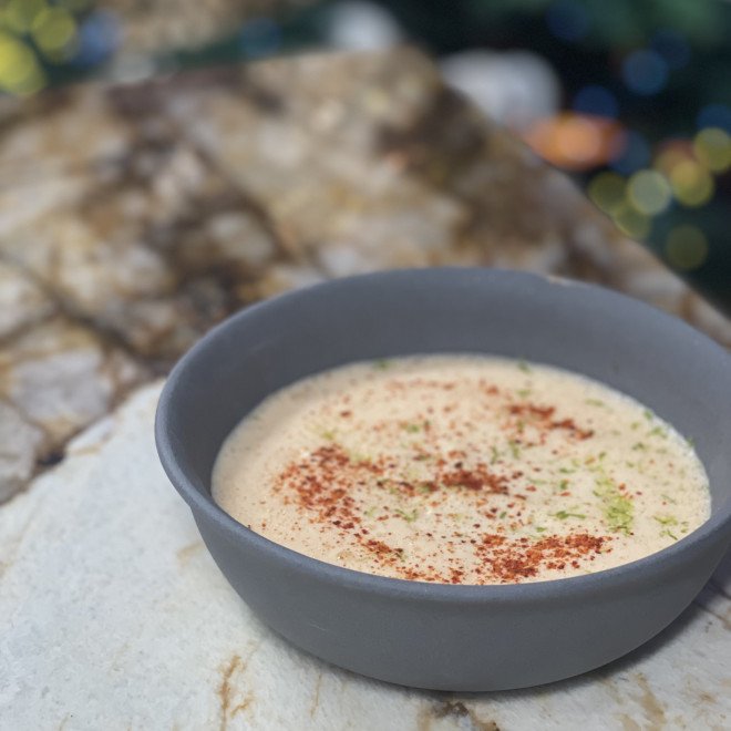 Ravioles de langoustines, crème au basilic et huile d'olive