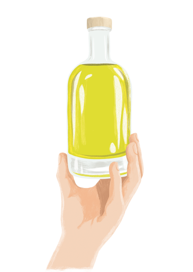 Main tenant une bouteille d'huile d'olive